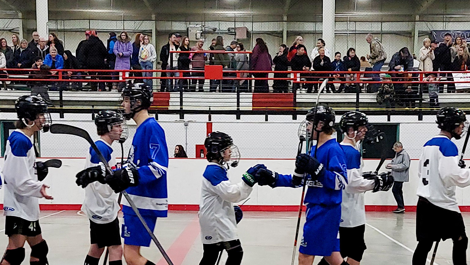 Parents watching the post game handshake line